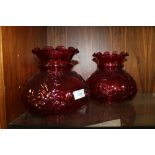 A PAIR OF RUBY GLASS OIL LAMP SHADES, base Dia. - internal approx 9 cm, external approx 10 cm, H