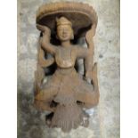 AN INDONESIAN CARVED HARDWOOD FIGURAL WALL HANGING, the figure in traditional dress, H 41 cm