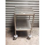 A METAL (STAINLESS STEEL) TWO TIER TROLLEY