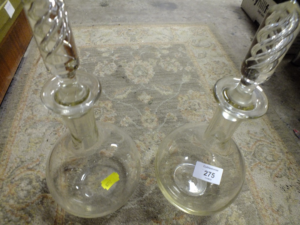 A PAIR OF ANTIQUE DECANTER WITH AIR TWIST STOPPERS