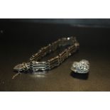 A SILVER GATE BRACELET TOGETHER WITH A GEM SET SILVER HEART LOCKET (2)