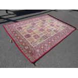 A LARGE MODERN RED WOOLLEN RUG 200 X 300 CM