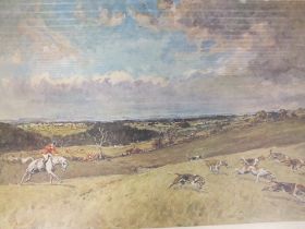 A FRAMED AND GLAZED HUNTING SCENE PRINT BY TOM CARR SIGNED IN PENCIL TO MOUNT - H 41 CM BY W 57 CM