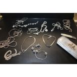 A QUANTITY OF STERLING SILVER NECKLACES TOGETHER WITH A HALLMARKED SILVER MOTHER OF PEARL FRUIT