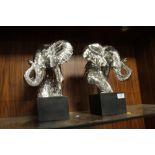 A PAIR OF MODERN SILVER EFFECT DECORATIVE MODELS OF ELEPHANTS - H 36 CM