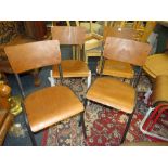 A SET OF FOUR INDUSTRIAL STYLE METAL AND PLY CHAIRS