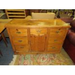 AN ANTIQUE PINE SIDEBOARD WITH SEVEN DRAWERS W-125 CM