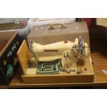 A CASED SEAMSTRESS SEWING MACHINE