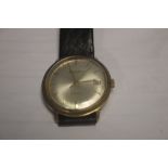 A VINTAGE BUECHE GIROD GENTLEMAN'S AUTOMATIC WRISTWATCH ON LEATHER STRAP