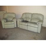 A GREEN LEATHER POWERED RECLINER TWO PIECE SUITE COMPRISING TWO SEATER SOFA AND A CHAIR