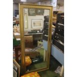 A LARGE BEVEL EDGED MIRROR IN GILT FRAME, 164 X 74 CM