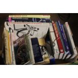 A TRAY OF CYCLING RELATED BOOKS (TRAYS NOT INCLUDED)