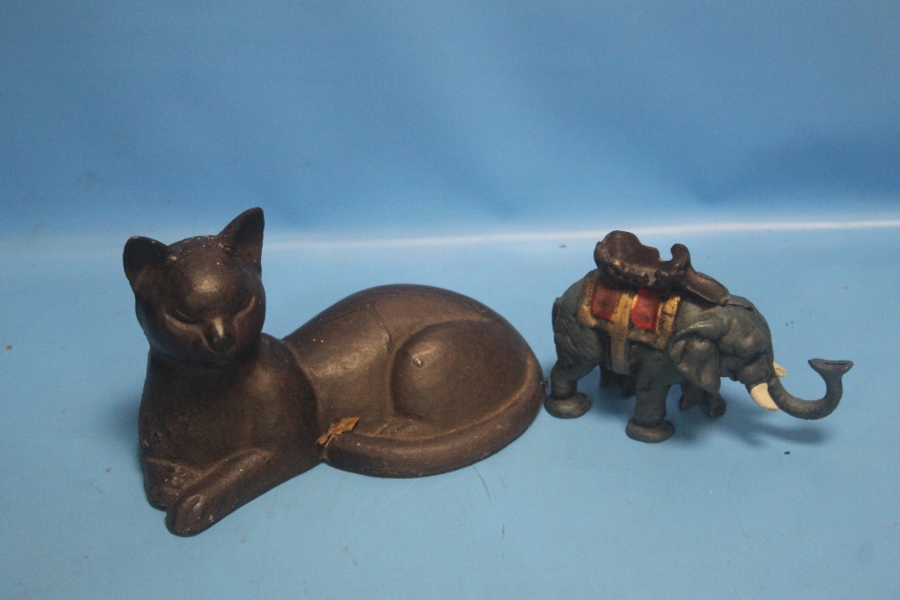 A CAST FIGURE OF A CAT TOGETHER WITH AN ELEPHANT MONEY BOX