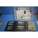 A SMALL QUANTITY OF UNUSED STAMPS, FIRST DAY COVERS, ALBUMS OF POSTCARDS ETC.