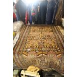 AN UNUSUAL HAND KNITTED EASTERN RUG WITH HIDDEN FACE DECORATION