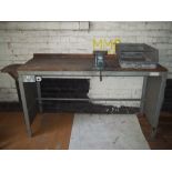 A STEEL WORK BENCH WITH AN ENGINEER'S SWIVEL VICE
