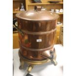 A LARGE ANTIQUE COPPER TEA URN ON CAST IRON PAN STAND WITH LION PAW FEET AND GAS RING