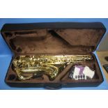 A CASED EASTROCK TENOR SAXAPHONE, AS NEW TOGETHER WITH FIVE SONG BOOKS