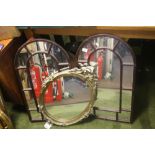 TWO ARCHED MIRRORS TOGETHER WITH AN OVAL GILT FRAMED MIRROR A/F, ARCHED MIRRORS 75 X 45 CM (3)