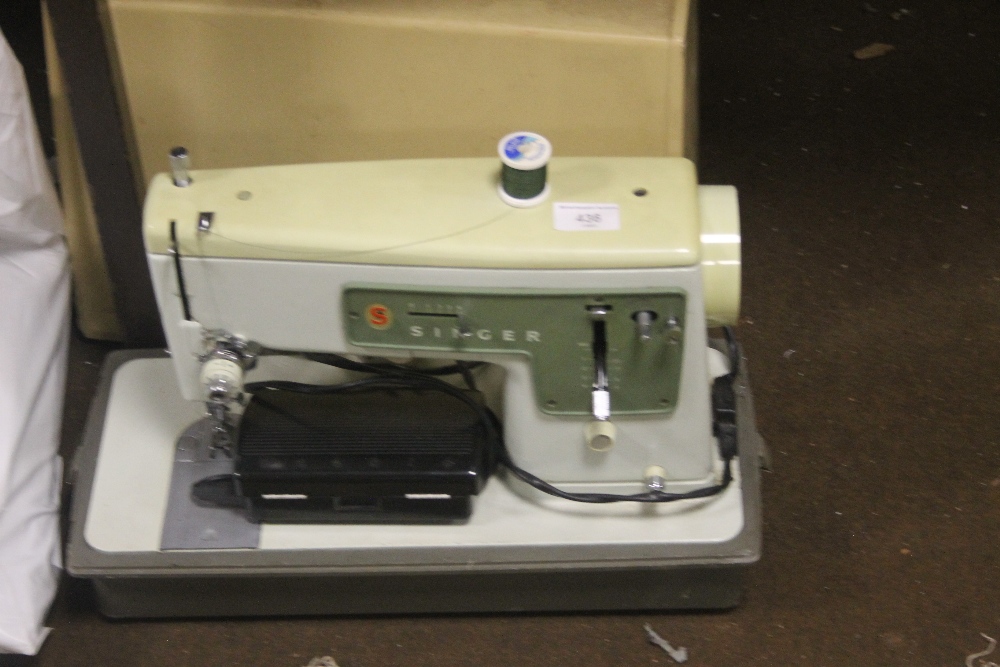 A CASED SEWING MACHINE