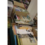 THREE TRAYS OF MISCELLANEOUS BOOKS TO INCLUDE NOVELS, AND A PHOTO ALBUM (TRAYS NOT INCLUDED)