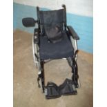 A SMALL SELF PROPELLED WHEELCHAIR