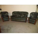 A GREEN LEATHER DESIGNER ITALIAN STYLE THREE PIECE SUITE COMPRISING THREE SEATER SOFA AND TWO