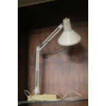 AN ANGLE POISED LAMP