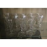 THIRTEEN MATCHED EARLY 19TH CENTURY DRINKING GLASSES WITH FACETED KNOP STEMS (13)