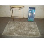 THREE ITEMS TO INCLUDE A MODERN HALL TABLE STAND, A RUG AND A BOXED LAWN AERATOR (3)