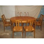 A NATHAN FURNITURE RETRO TEAK EXTENDING DINING SET, SIX CHAIRS AND A TABLE