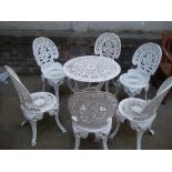 A CAST ALUMINIUM GARDEN TABLE PATIO SET WITH SIX CHAIRS