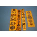 A COLLECTION OF MILITARY BADGES MOUNTED ON C ARD STRIPS TO INCLUDE "TYNESIDE SCOTTISH", "OXFORD