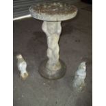 A CONCRETE CHERUB BIRD BATH AND TWO CONCRETE GARDEN GNOMES