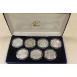 A CASED COMPLETE COLLECTION OF H M QUEEN ELIZABETH II CROWNS 1953 - 1981