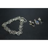 A SILVER AND MARCASITE BRACELET TOGETHER WITH THREE PENDANTS (4)