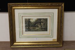 A PAIR OF GILT FRAMED AND GLAZED HAND COLOURED ENGRAVINGS OF WOODED LANDSCAPES BY AUBINIERE, 23 X 33