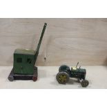 A VINTAGE TINPLATE TRACTOR TOY TOGETHER WITH A VINTAGE TINPLATE CRANE