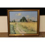 A GILT FRAMED IMPRESSIONIST OIL ON CANVAS DEPICTING A COUNTRY PATH WITH COTTAGE INDISTINCTLY