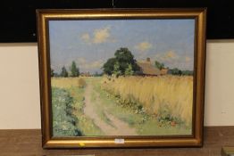 A GILT FRAMED IMPRESSIONIST OIL ON CANVAS DEPICTING A COUNTRY PATH WITH COTTAGE INDISTINCTLY