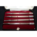 A SET OF FOUR STERLING SILVER BRIDGE PENCILS