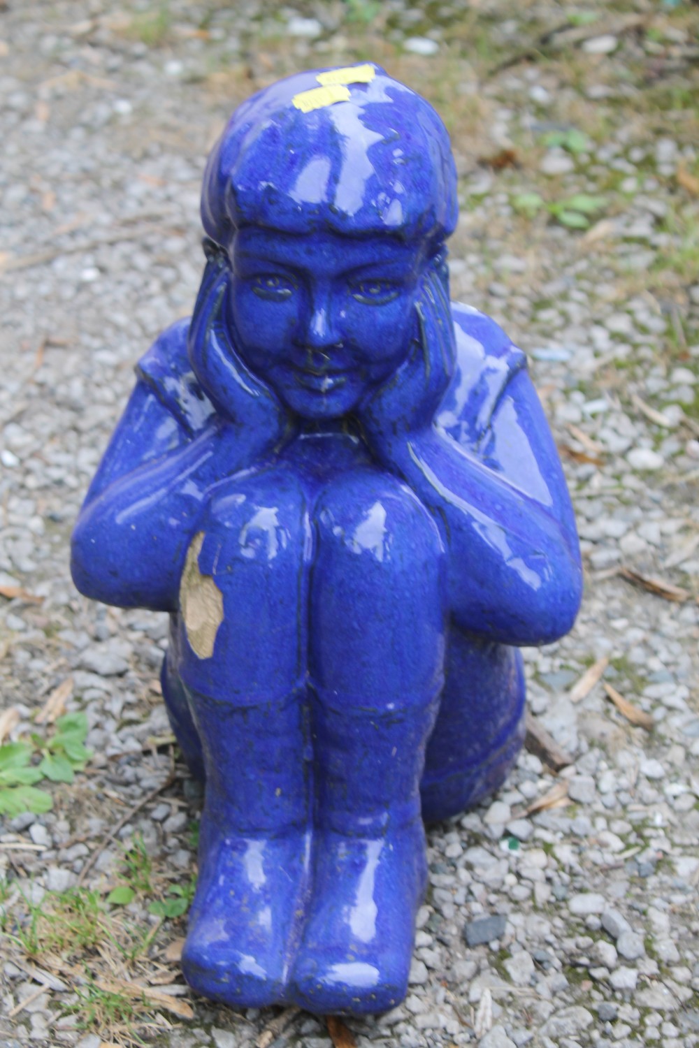 A BLUE GLAZED GARDEN FIGURE OF A GIRL