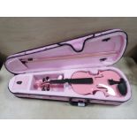 A MODERN PINK VIOLIN WITH BOW AND PINK CARRY CASE