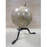 A VINTAGE GLOBE ON FOLDING TRIPOD BASE - DENTED