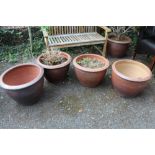A PAIR OF GARDEN PLANT POTS - ONE WITH CONTENTS, TOGETHER WITH TWO OTHERS, LARGEST DIA. 53 CM