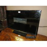 A SAMSUNG 27" FLATSCREEN TV WITH REMOTE - HOUSE CLEARANCE