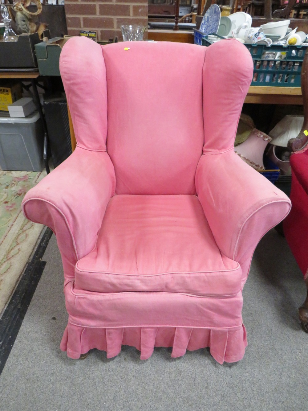 A VINTAGE UPHOLSTERED COUNTRY HOUSE STYLE ARMCHAIR