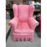 A VINTAGE UPHOLSTERED COUNTRY HOUSE STYLE ARMCHAIR
