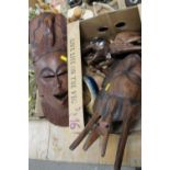 A BOX OF TREEN TO INCLUDE CARVED ELEPHANTS, MASKS ETC