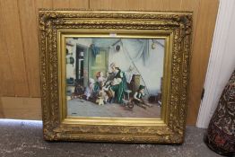 A GILT FRAMED OIL ON BOARD DEPICTING AN INTERIOR SCENE OF A ,FATHER WITH MANY CHILDREN - SIGN MARK